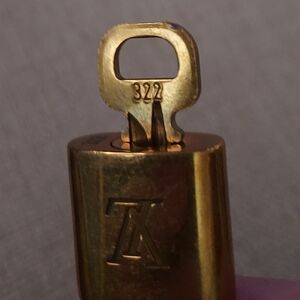 Louis Vuitton Gold Lock